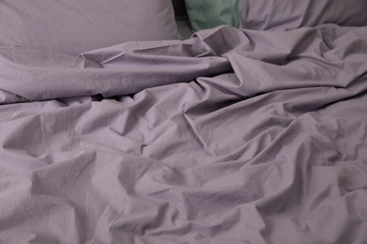 Soft dusty mauve bedding from Supreme Rest, crafted from eco-friendly cotton with a naturally relaxed texture and custom-made luxury finish