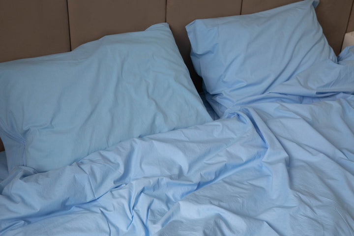 Close-up of Supreme Rest’s custom-made, sky blue bedding—soft textures and eco-friendly luxury for everyday comfort