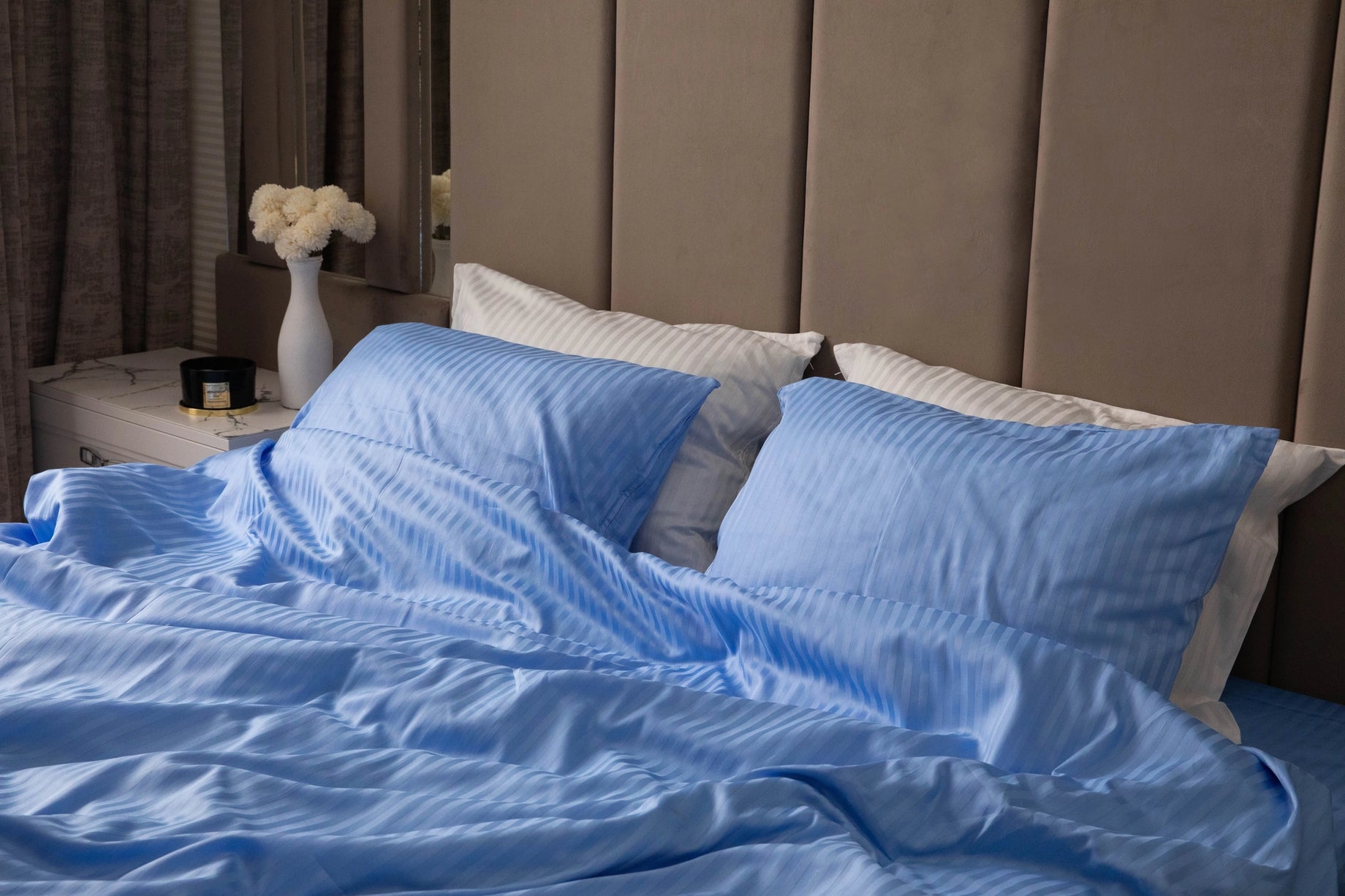 Luxurious Celestial Blue bedding set on a bed, creating a calming and elegant atmosphere.