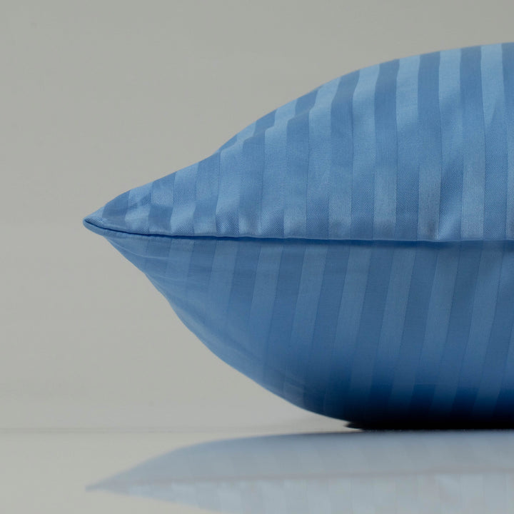 Deep blue striped pillowcase with a silky sateen finish for a touch of sophistication.
