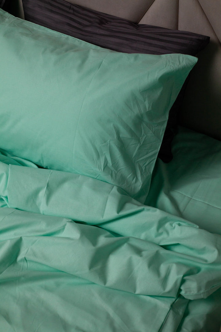 Close-up of a Glacial Waters ranforce pillowcase resting on a matching duvet cover