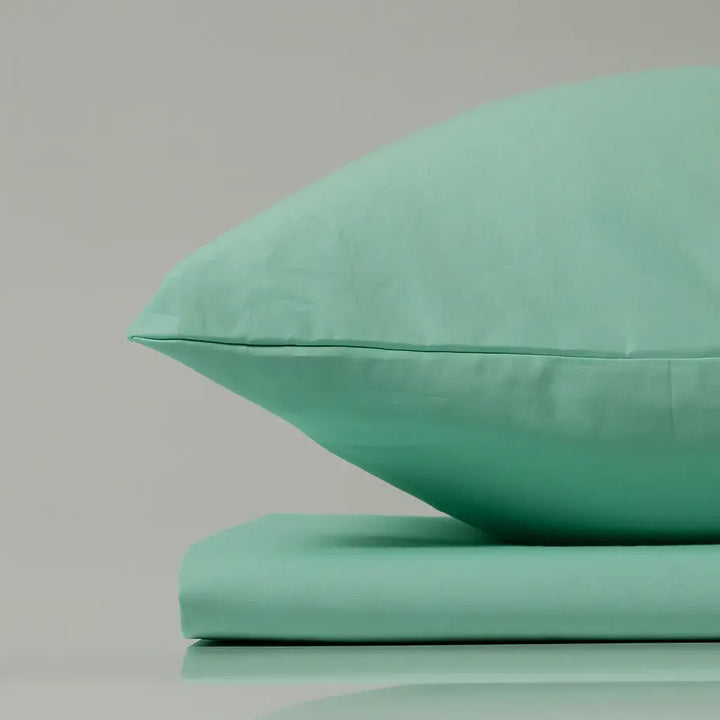 Supreme Rest Glacial Waters aqua pillow and sheet set – eco-friendly custom bedding designed for fresh, modern and sustainable sleep comfort.