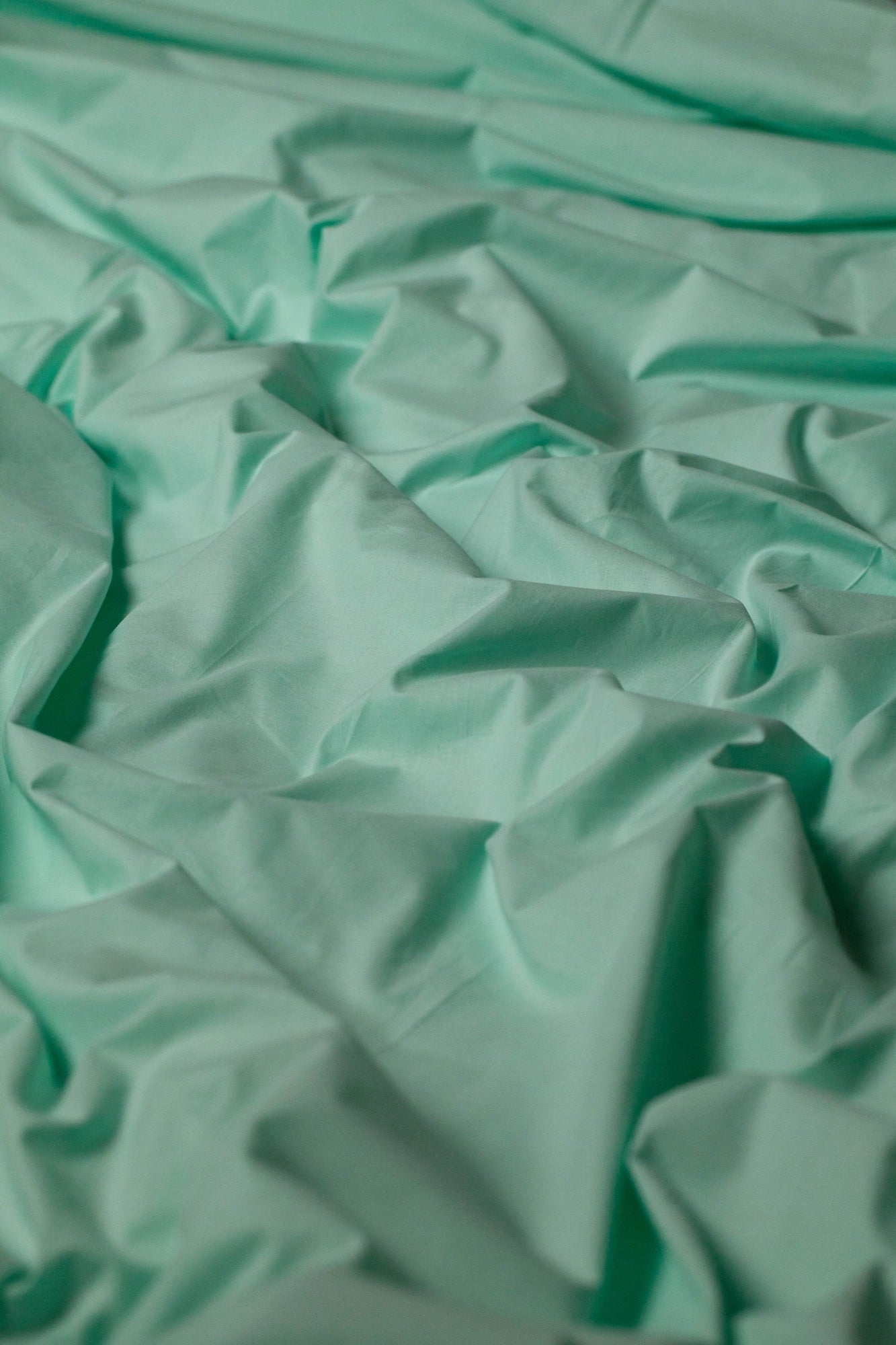 Soft and smooth Glacial Waters ranforce bedding set arranged on a bed for a serene aesthetic