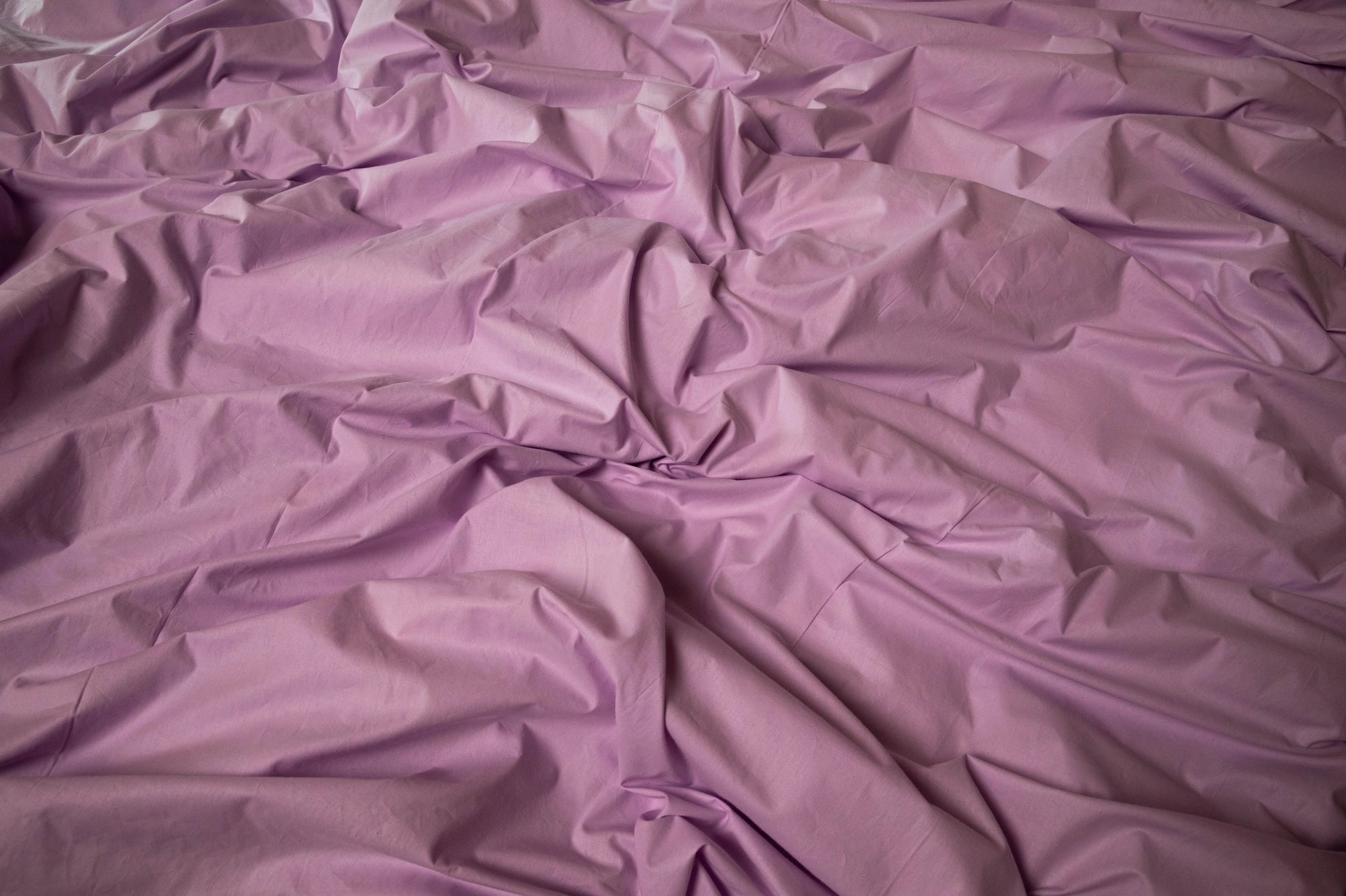 Elegant Supreme Rest lilac bedding set displayed on a modern bed frame