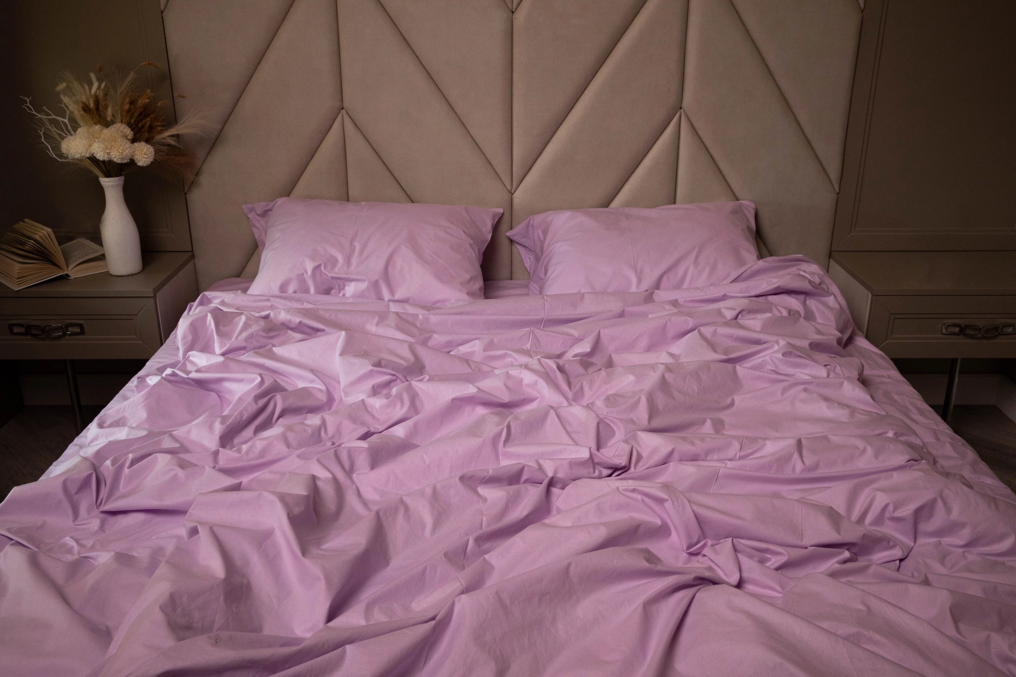 Pillow and duvet cover in a soothing lilac hue on a neatly made bed