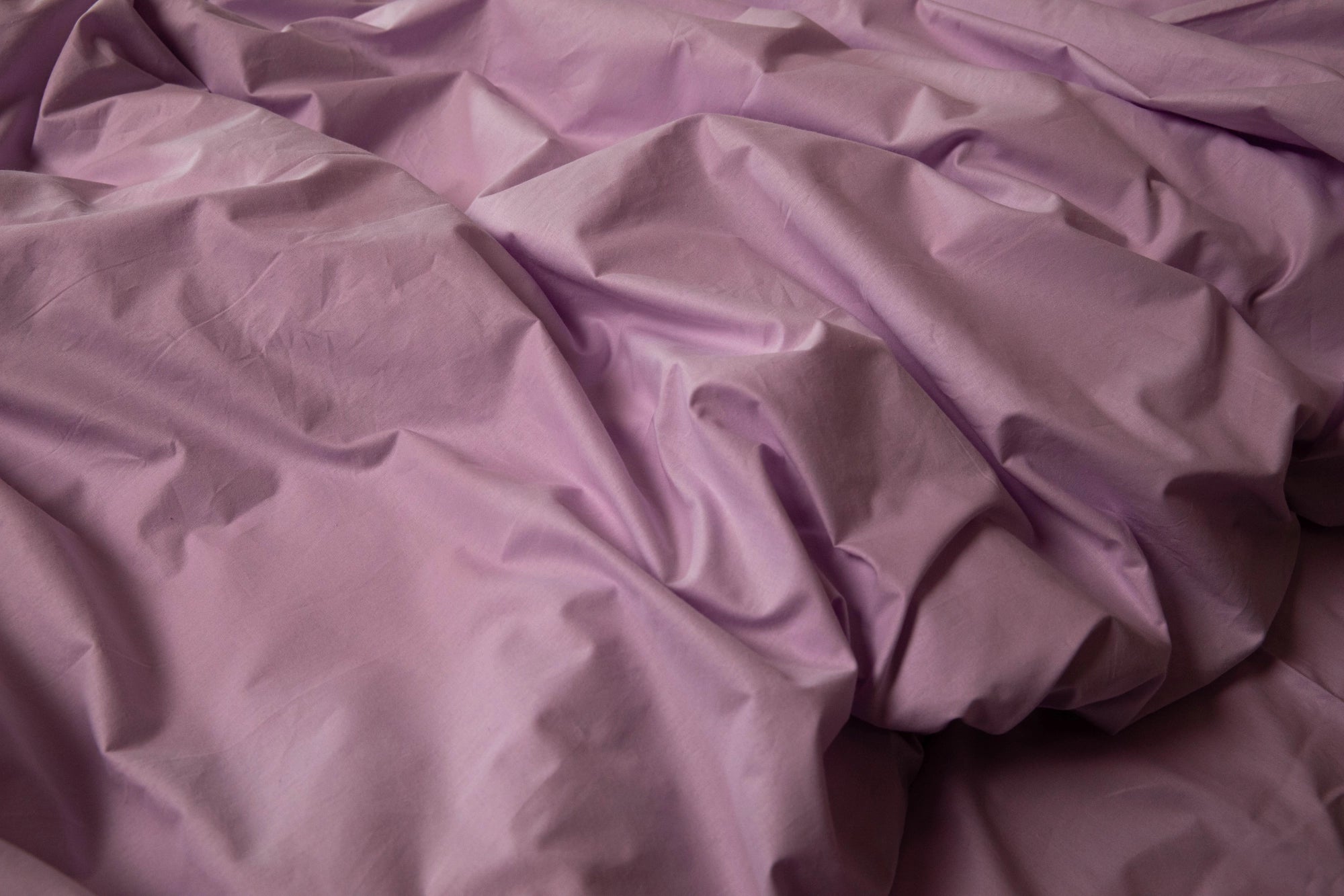 Detail shot of the lilac pillowcase showcasing the smooth texture of ranforce fabric