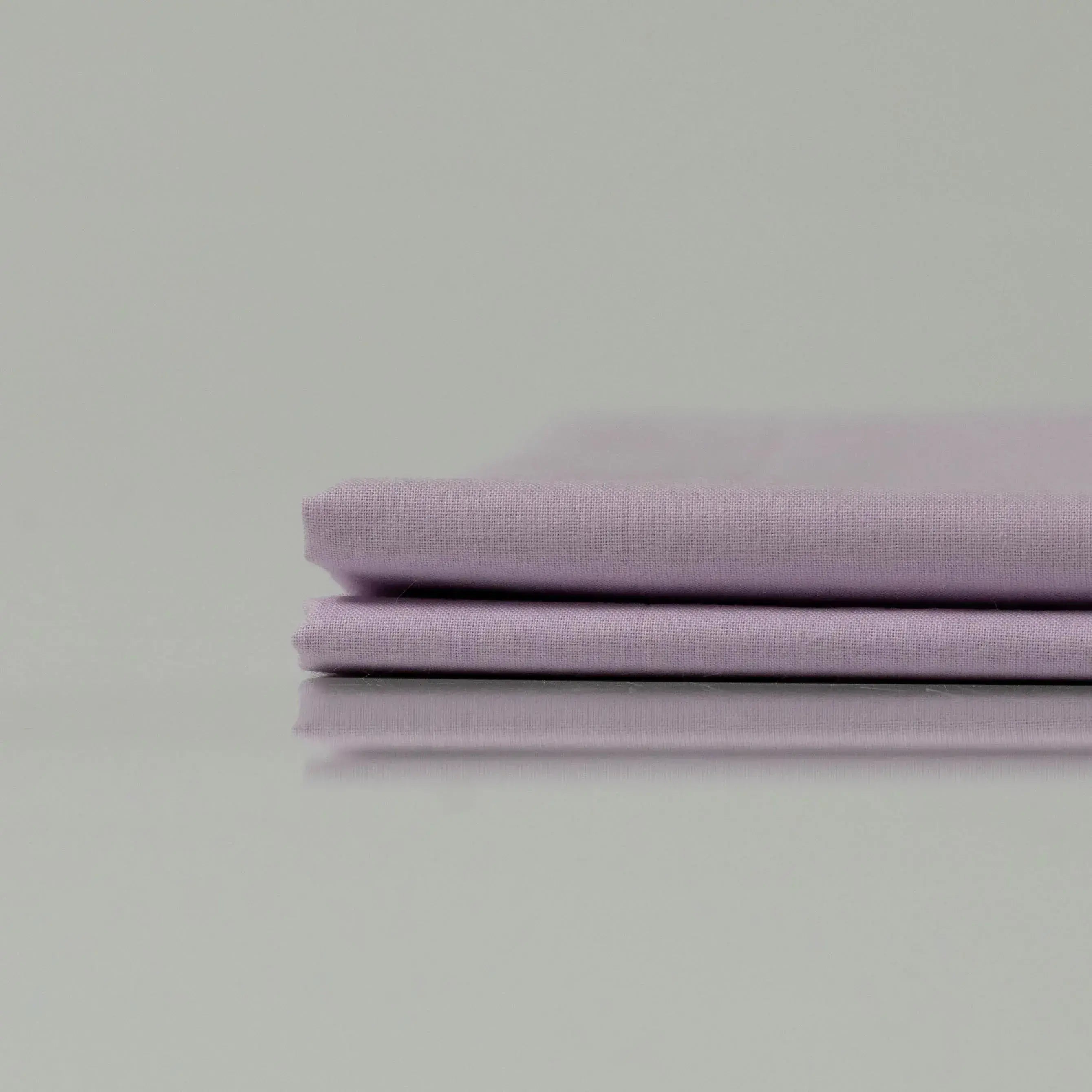 Supreme Rest Heavenly Lilac folded sheet set – eco-friendly custom bedding in soft lilac tone for luxurious, sustainable sleep comfort.