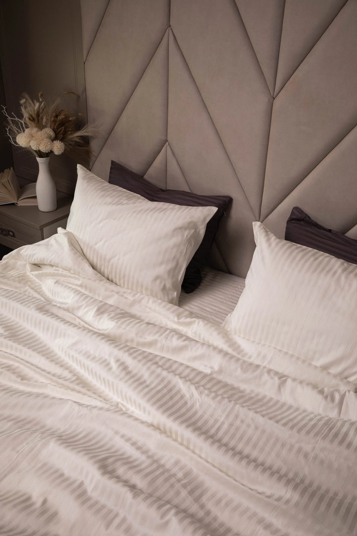 Neutral color palette bedroom with Ivory Dune sateen bedding, creating a spa-like atmosphere.