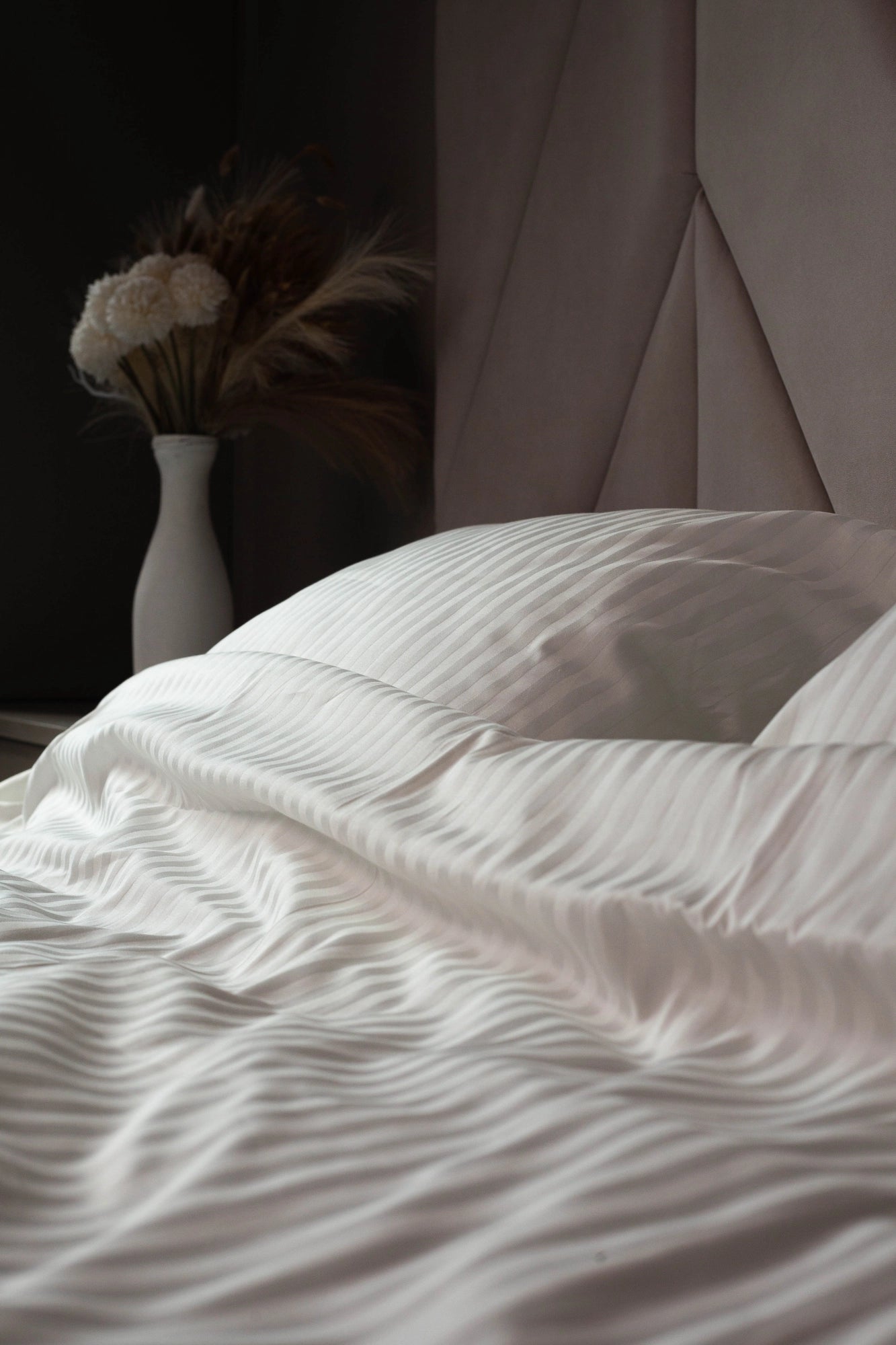 Close-up of Ivory Dune sateen fabric, featuring delicate stripes and a soft, breathable weave.