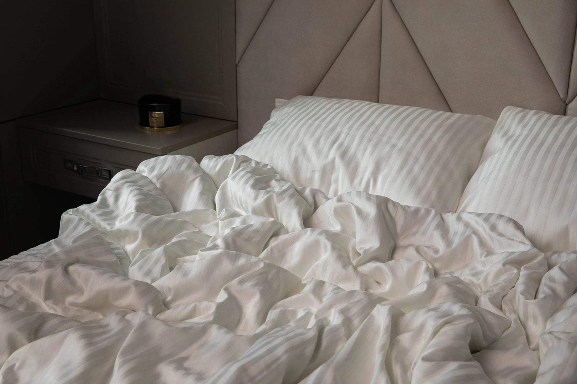 Elegant bedroom featuring Supreme Rest Ivory Dune bedding, styled for a cozy yet refined look.