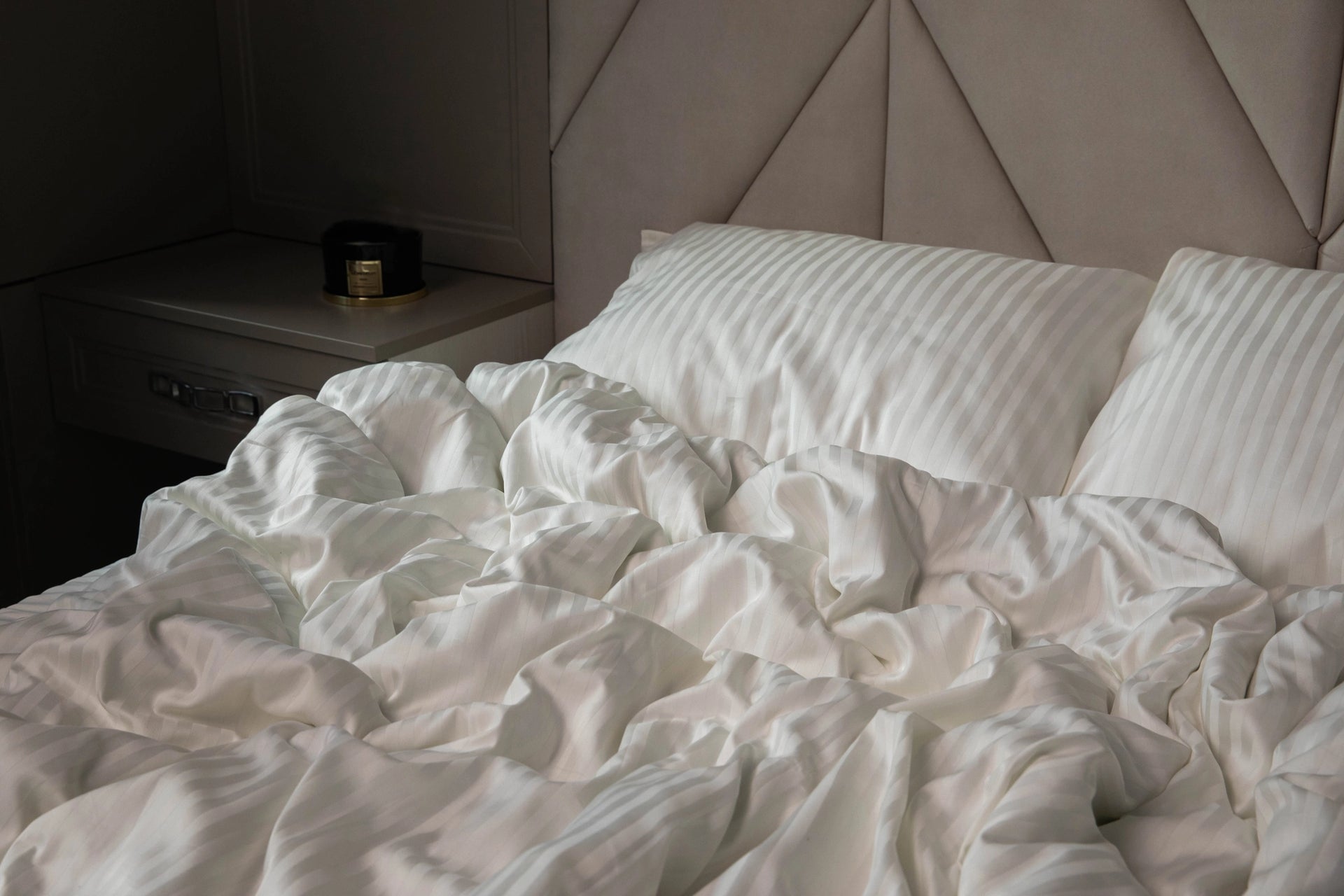 Elegant bedroom featuring Supreme Rest Ivory Dune bedding, styled for a cozy yet refined look.