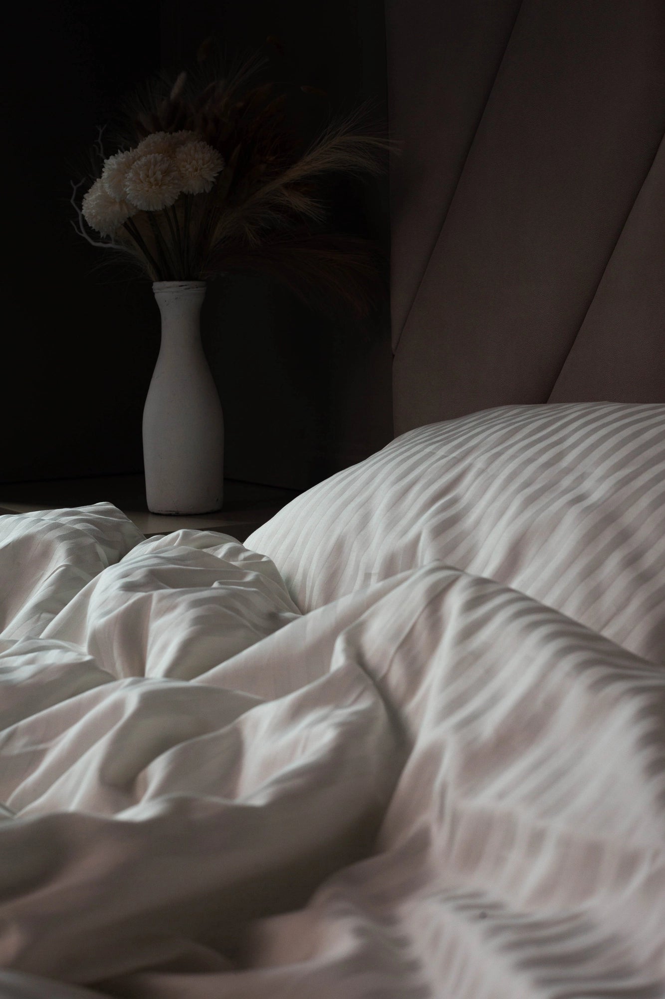 Supreme Rest Ivory Dune sateen sheets, emphasizing their silky texture and durability.