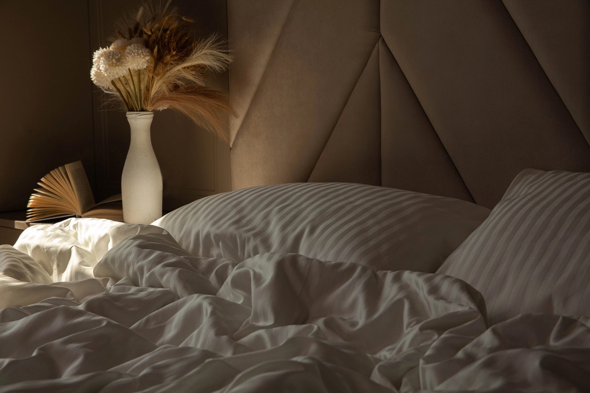Neutral color palette bedroom with Ivory Dune sateen bedding, creating a spa-like atmosphere.
