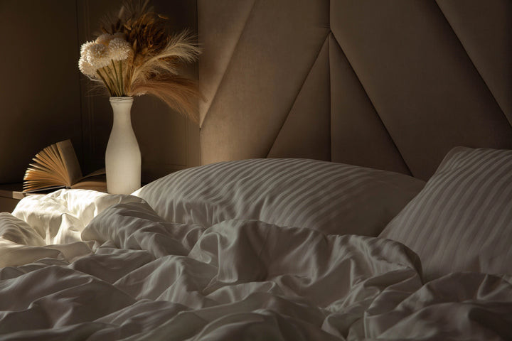 Neutral color palette bedroom with Ivory Dune sateen bedding, creating a spa-like atmosphere.