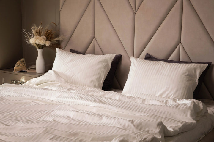 Neutral-toned bedroom with Supreme Rest’s Ivory Dune sateen bedding, creating a calming atmosphere.
