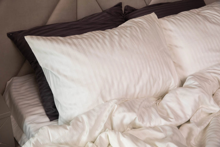 Minimalist bedroom with Supreme Rest’s Ivory Dune bedding set, adding a touch of understated luxury.