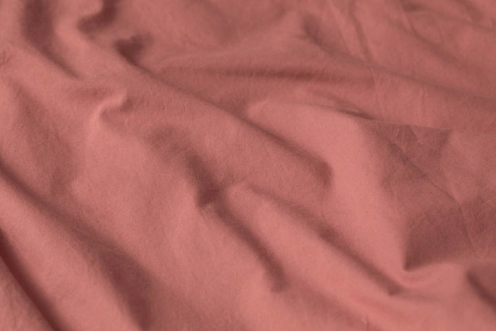 Close-up of Supreme Rest’s vintage rose cotton bedding, showcasing the breathable weave and naturally soft texture ideal for elevated sleep comfort and aesthetic charm