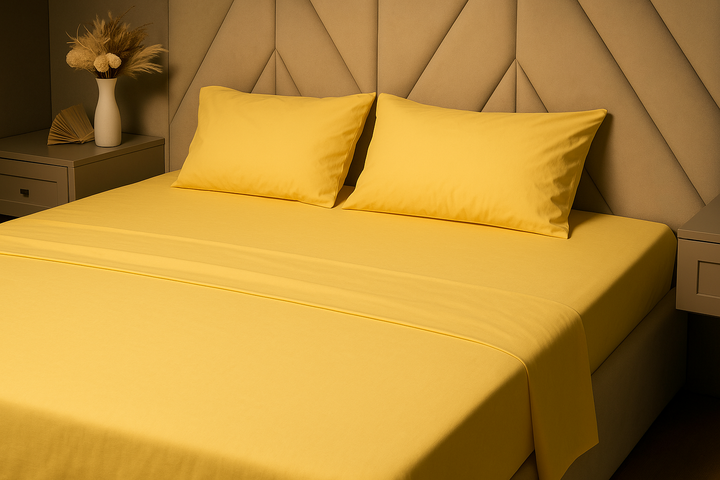 Custom-crafted yellow bed sheet set in a contemporary bedroom—made from breathable, hypoallergenic, and eco‑friendly materials for a clean, handcrafted sleep experience