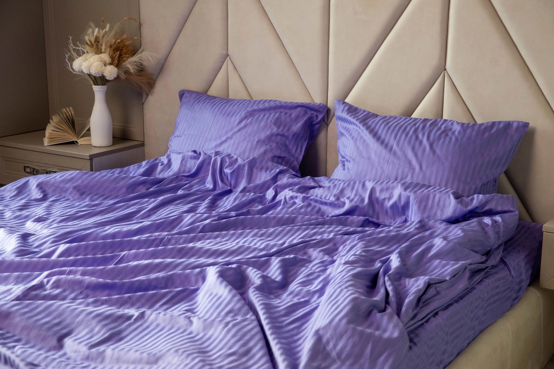 Luxurious deep purple Patagonian Lupine bedding set on a modern bed, creating an elegant atmosphere.