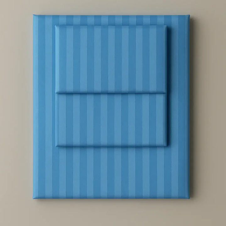 Supreme Rest Celestial Blue folded striped bedding set – eco-friendly custom sheets and pillowcases for modern, luxurious sleep comfort.