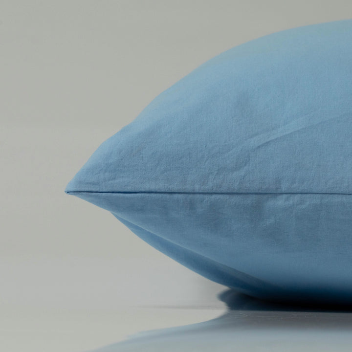 Supreme Rest’s custom-made sky blue pillowcase in breathable, eco-friendly cotton, presented in a clean, minimalist setting