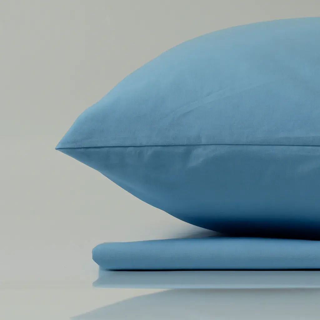 Supreme Rest handcrafted sky blue pillow and sheet set – eco-friendly bedding blending elegant design with sustainable sleep comfort.