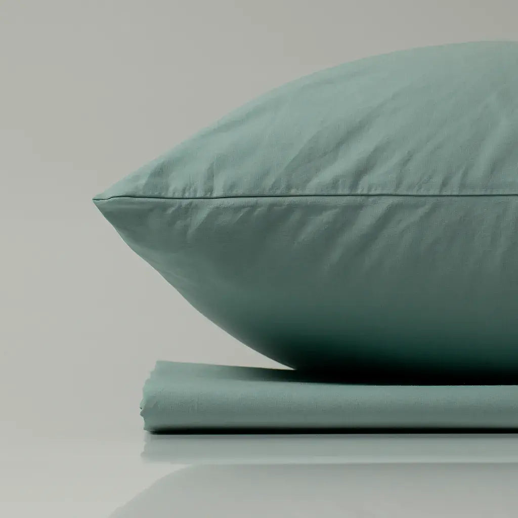 Supreme Rest eco-friendly custom-made bedding set with soft mint green pillow and sheet – handcrafted luxury for restful, sustainable sleep.