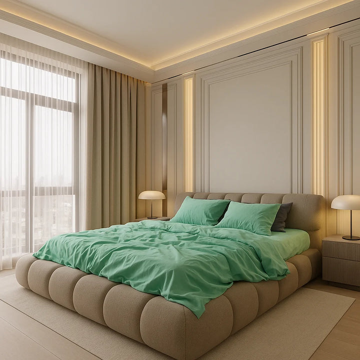 Custom-designed eco bedroom featuring a handcrafted tufted bed frame and premium green organic bedding in a softly lit minimalist interior