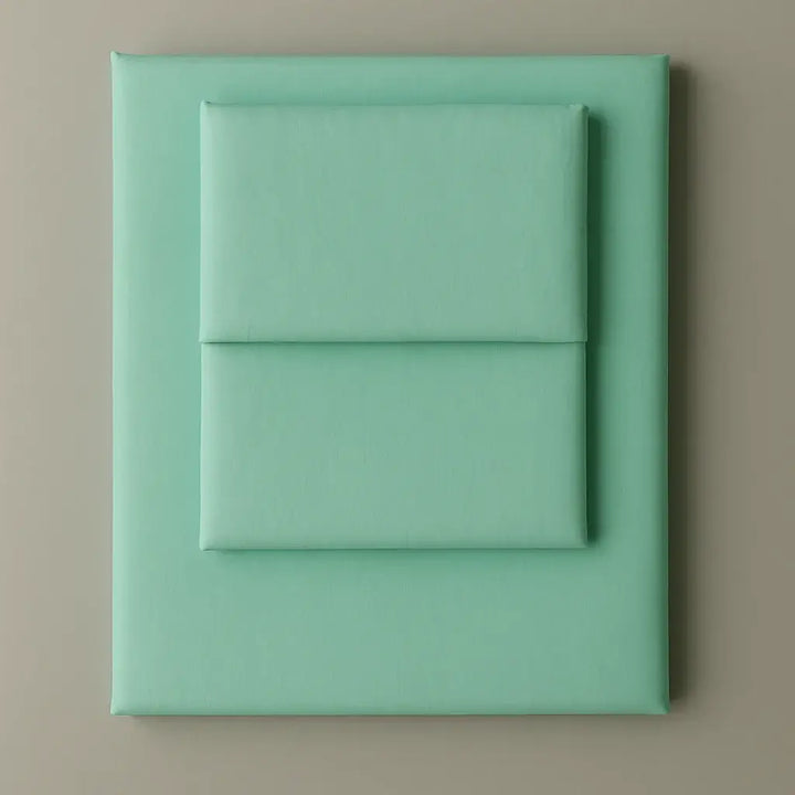 Supreme Rest Glacial Waters folded sheet and pillowcase set – eco-friendly custom bedding in soft aqua for modern, sustainable sleep comfort.