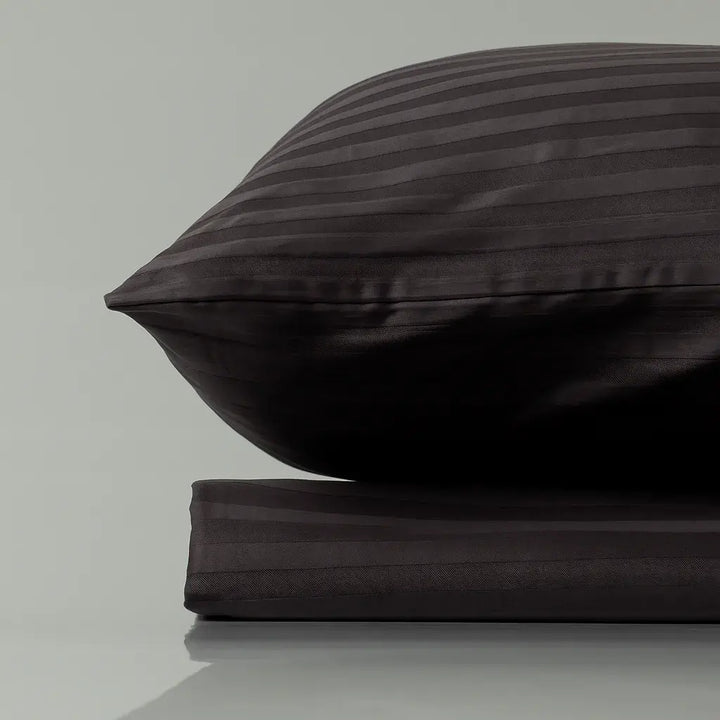 Supreme Rest Graphite Chic striped pillow and sheet set – eco-friendly custom bedding blending modern elegance with sustainable comfort.