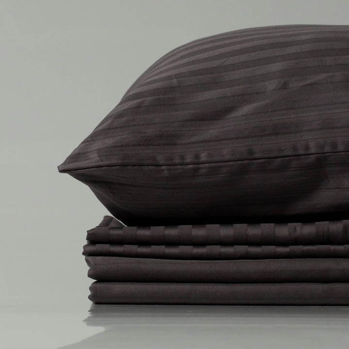 Supreme Rest deep charcoal striped bedding set, showcasing eco-friendly, custom made craftsmanship with a luxurious touch
