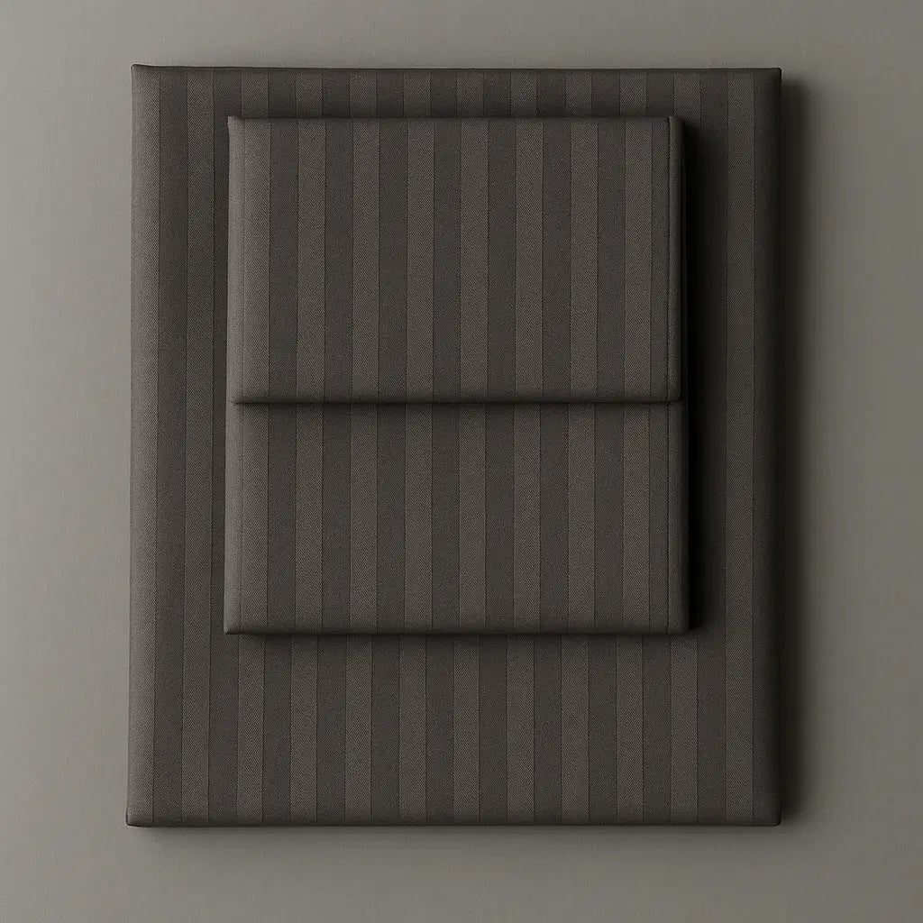 Supreme Rest Graphite Chic folded striped bedding set – eco-friendly custom sheets and pillowcases for modern, luxurious sleep comfort.