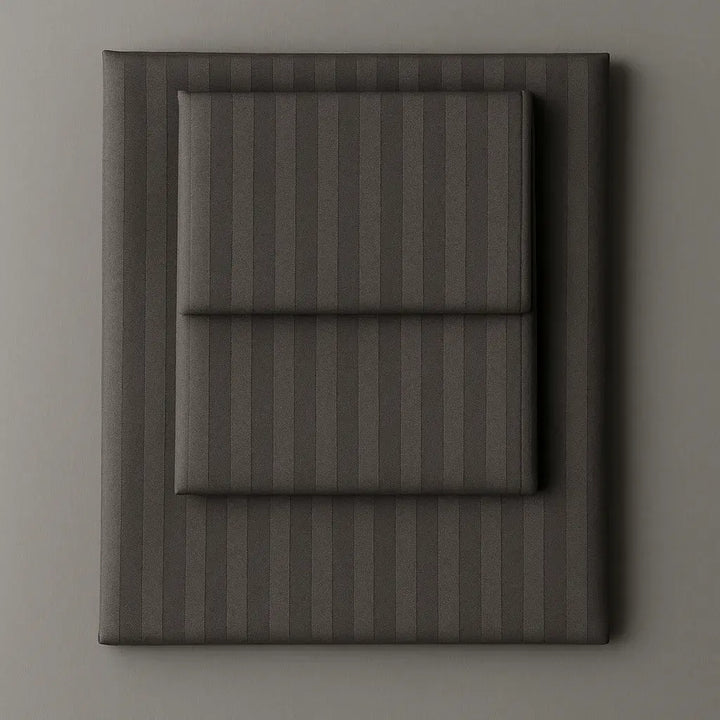 Supreme Rest Graphite Chic folded striped bedding set – eco-friendly custom sheets and pillowcases for modern, luxurious sleep comfort.