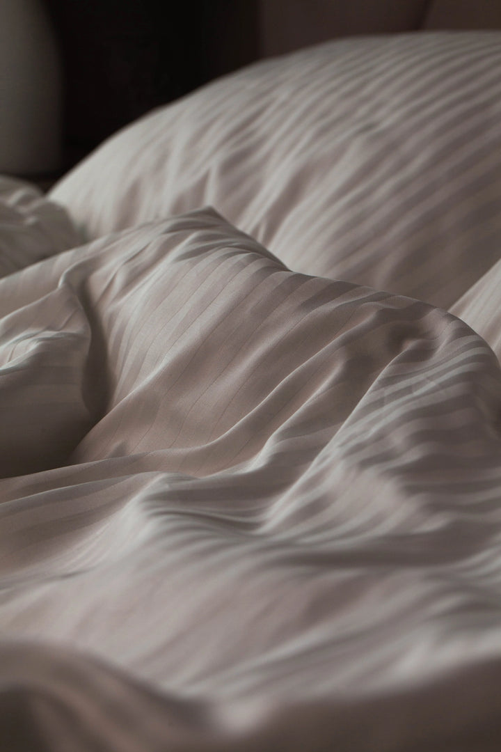 Custom-made, eco-friendly striped sateen bedding crafted for Supreme Rest - luxuriously soft with a natural sheen and artisan finish