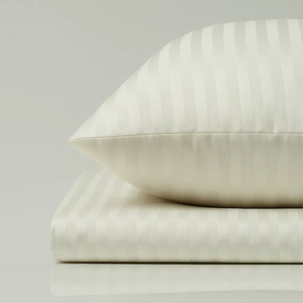 Supreme Rest Ivory Dune striped pillow and sheet set – eco-friendly custom bedding crafted for elegant, hotel-style luxurious sleep.