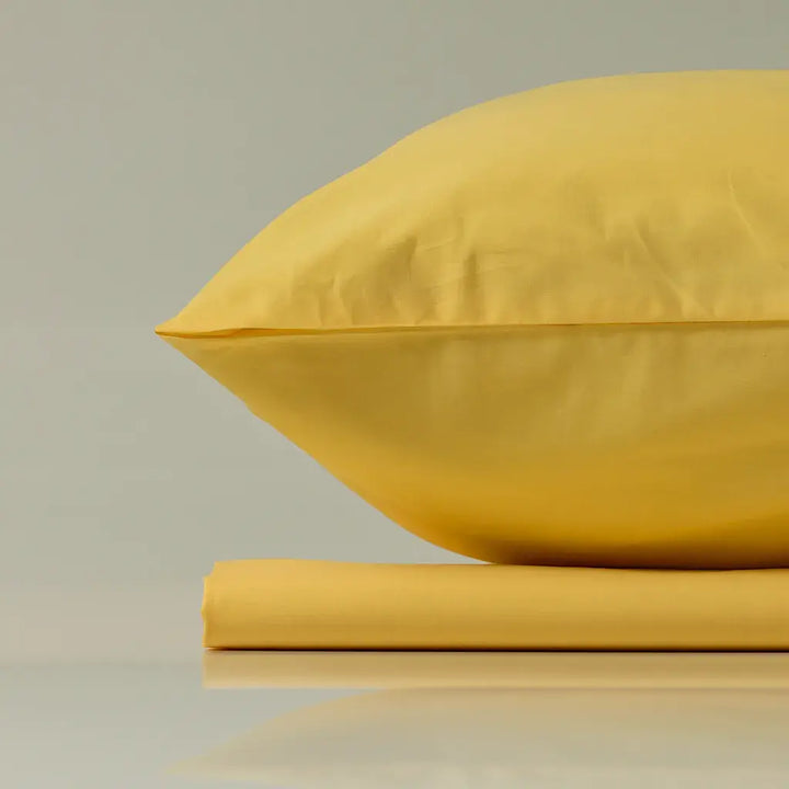 Supreme Rest Lemon Sunbeam yellow pillow and sheet set – eco-friendly custom bedding designed for bright, luxurious sleep comfort.