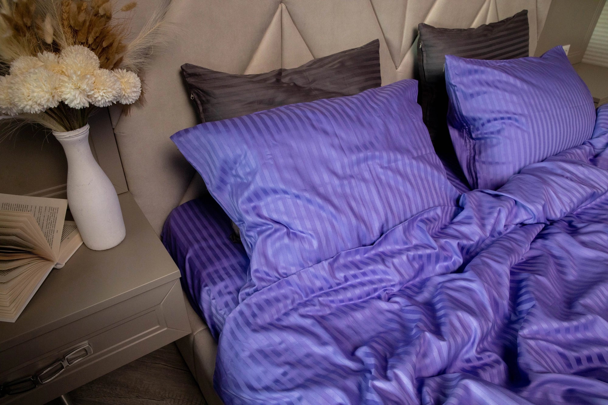 Plush Patagonian Lupine duvet cover draped over a bed, showcasing its silky smooth fabric.
