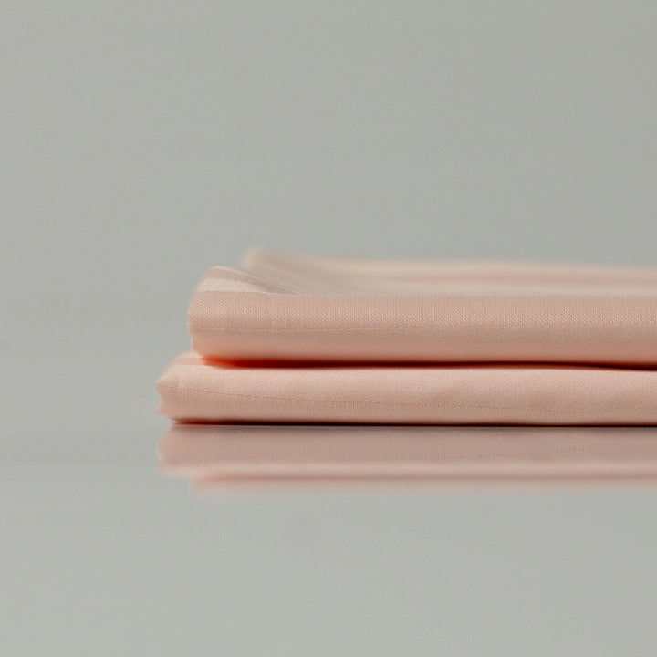 Soft eco-friendly fabric folded neatly — custom made and crafted by Supreme Rest for sustainable bedding luxury