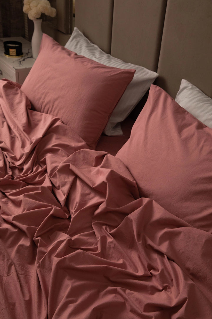 Supreme Rest stonewashed cotton bedding in rosewood, artfully rumpled for a relaxed, lived-in look - a custom-made, eco-friendly set designed for everyday luxury