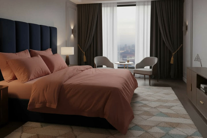Supreme Rest's clay-red breathable cotton sheets. Effortless comfort and organic style in a sunlit bedroom