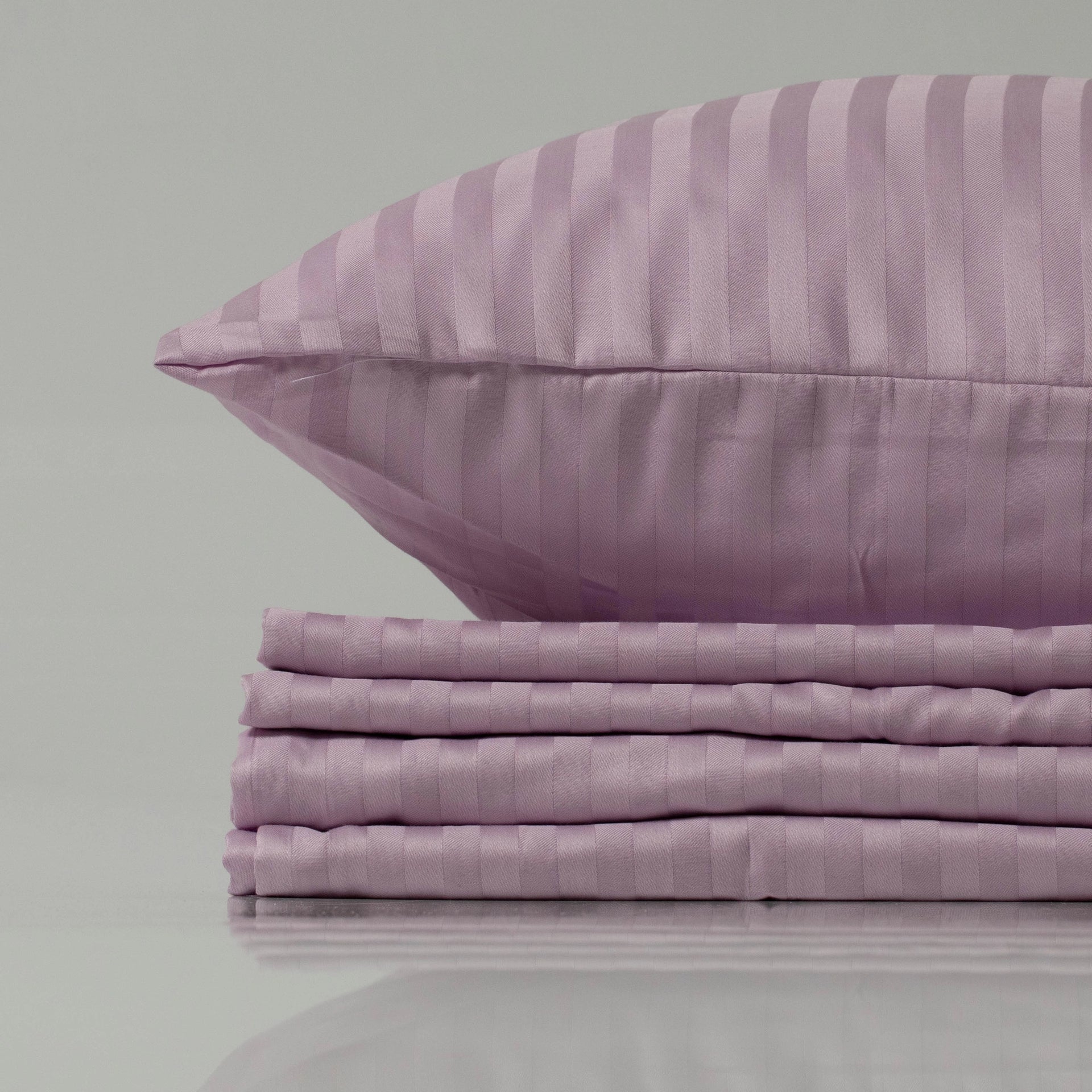 Soft lilac bedding set by Supreme Rest, featuring a striped sateen weave for a luxurious sheen, crafted with eco-friendly materials and custom detailing for refined comfort