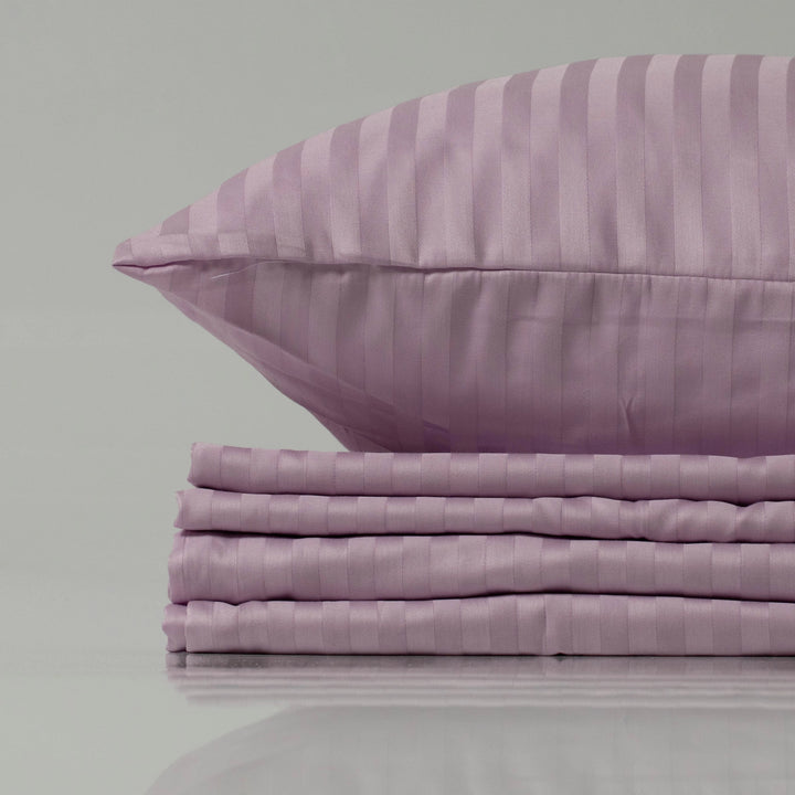 Soft lilac bedding set by Supreme Rest, featuring a striped sateen weave for a luxurious sheen, crafted with eco-friendly materials and custom detailing for refined comfort