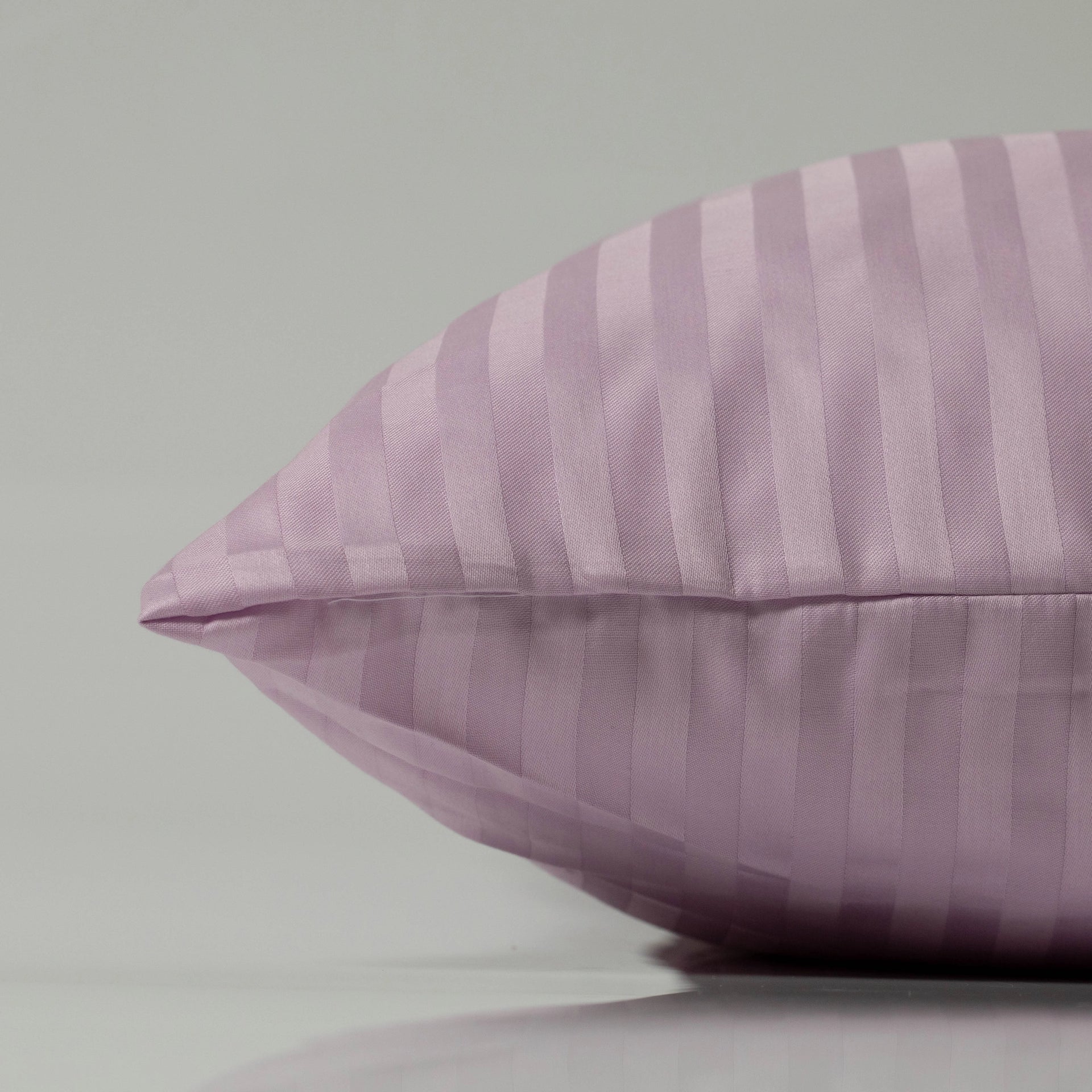 Lavender-toned pillow with a subtle sateen stripe pattern, offering a soothing blend of elegance and softness for elevated rest