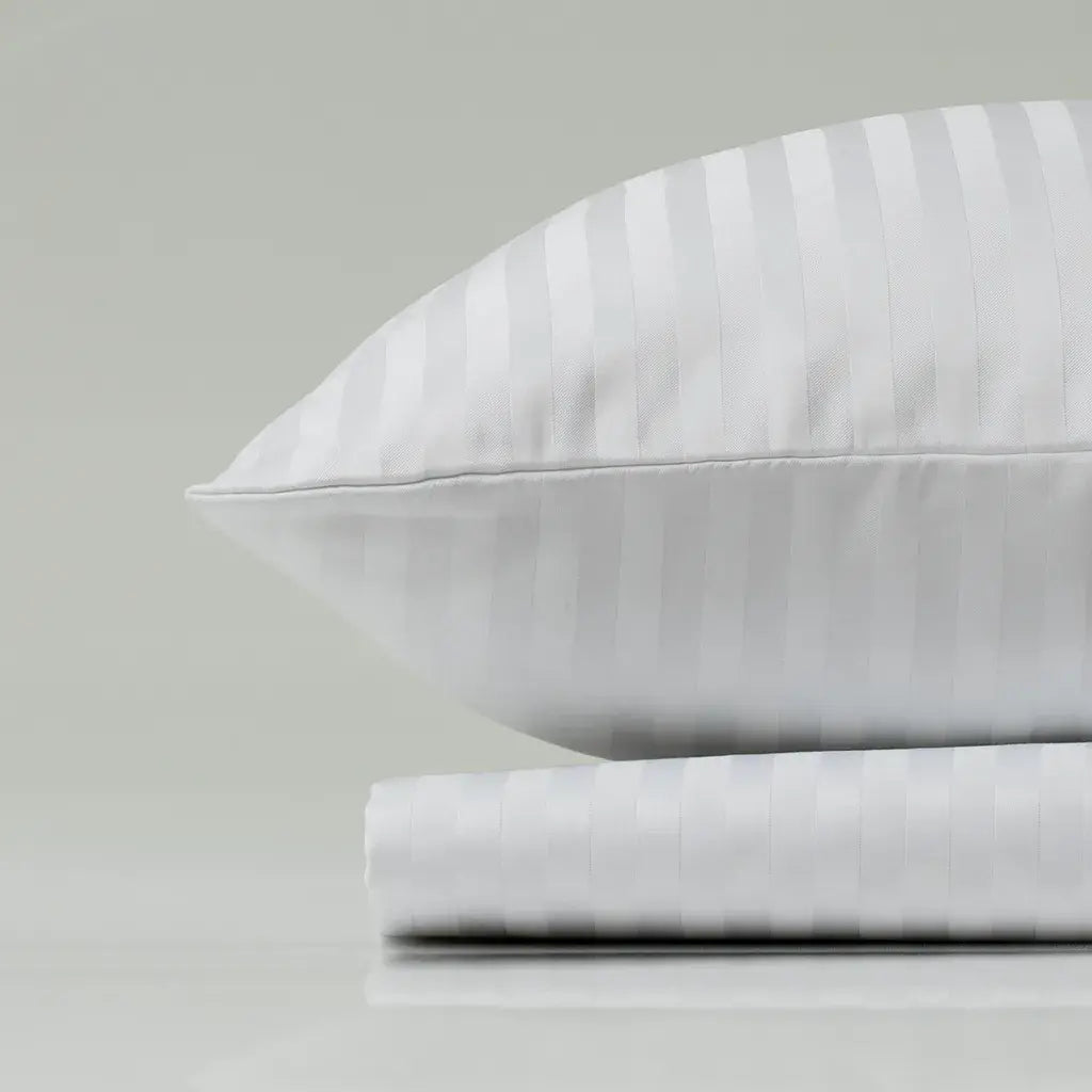 Supreme Rest handcrafted white stripe bedding set – eco-luxury pillow and sheet designed for serene sleep and timeless bedroom elegance.