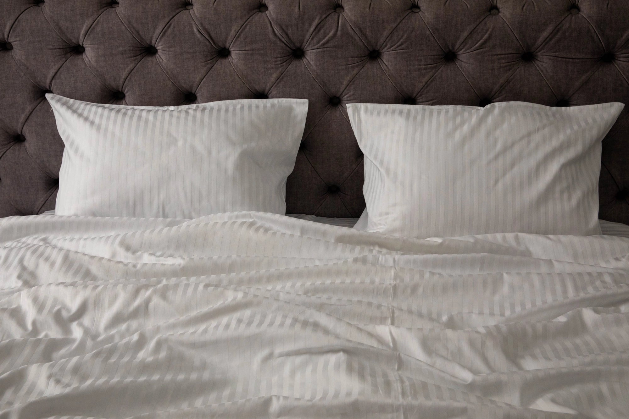 Luxurious striped white bedding by Supreme Rest, custom made for elegance and crafted to deliver an eco-friendly sleep experience