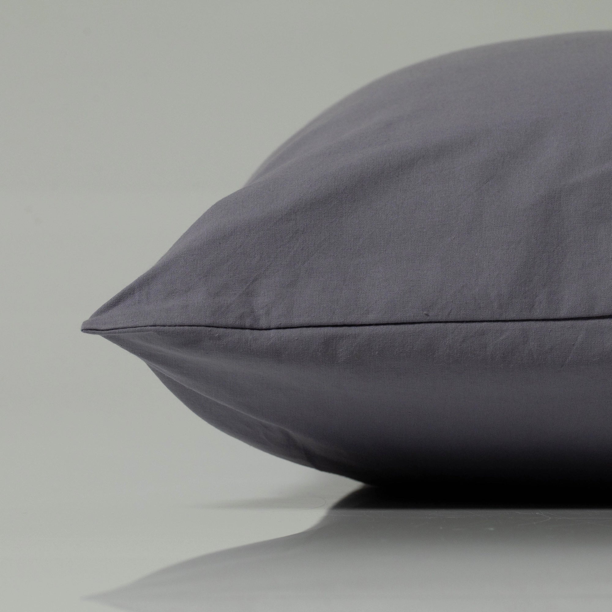 Luxury pillow in a rich graphite grey, crafted from smooth, breathable fabric with a clean tailored seam