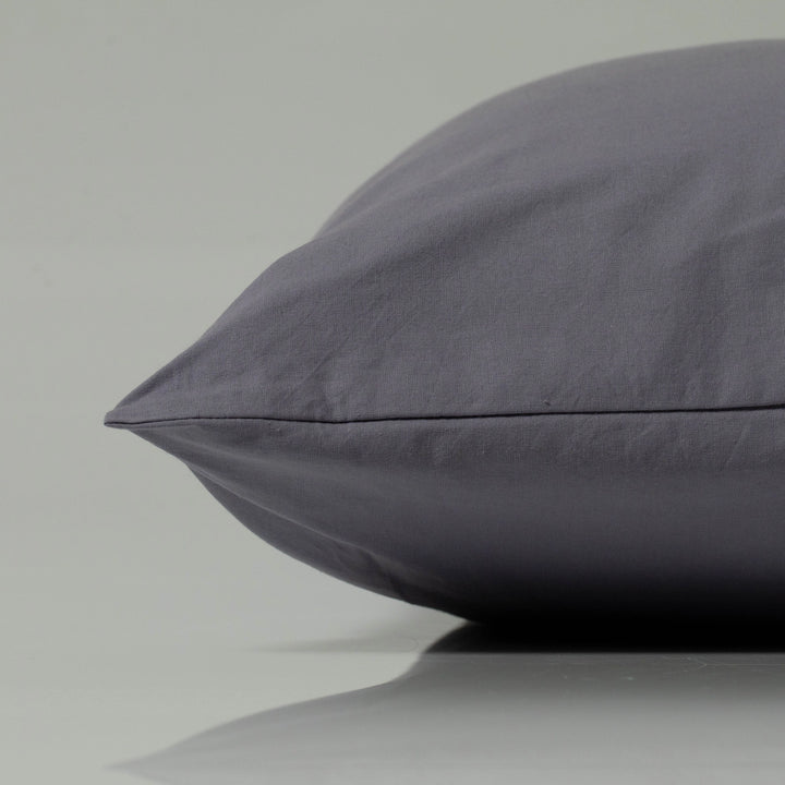 Luxury pillow in a rich graphite grey, crafted from smooth, breathable fabric with a clean tailored seam