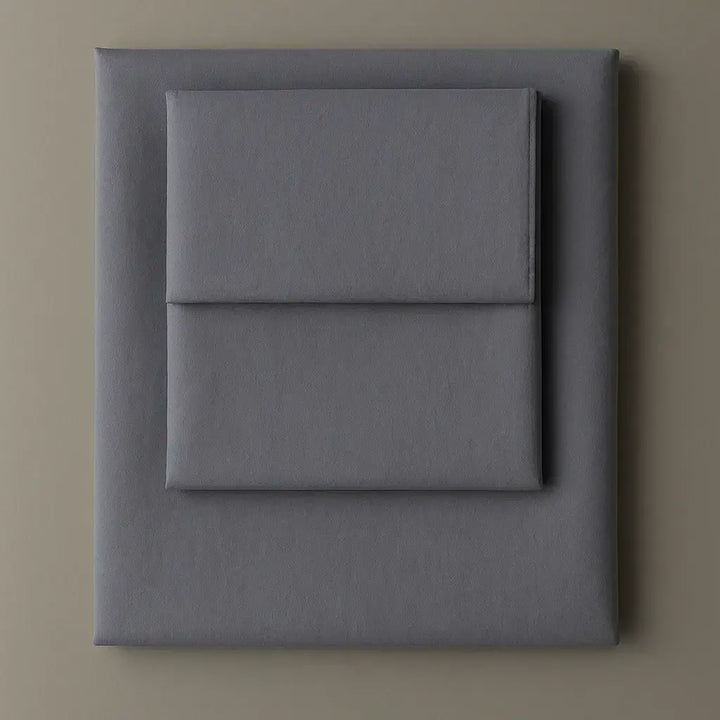 Supreme Rest Slate Blue Serenity folded sheet and pillowcase set – eco-friendly custom bedding for modern, elegant and sustainable sleep.