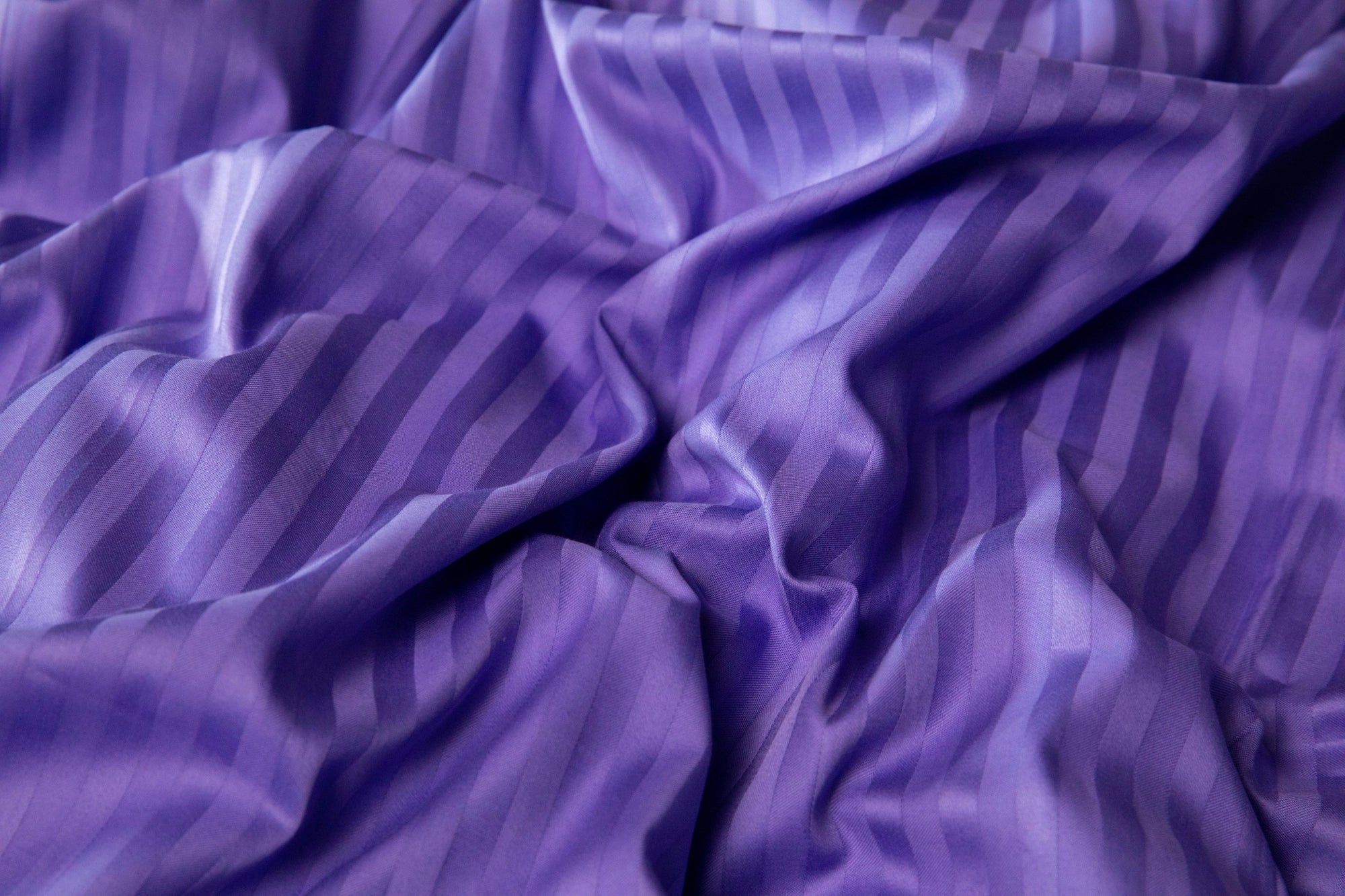 Wrinkled Patagonian Lupine duvet cover showcasing the softness and natural drape of sateen fabric.