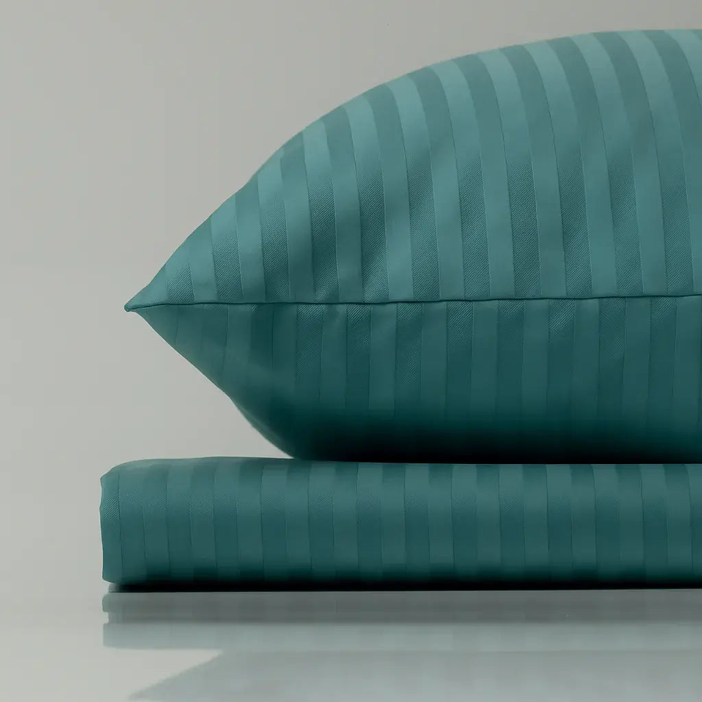 Supreme Rest turquoise striped pillow and sheet – eco-friendly custom bedding offering handcrafted luxury and serene sleep comfort.